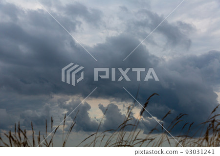 Dramatic dark cloudy sky over sea, natural photo background Dramatic dark cloudy sky over sea, natural photo background 93031241