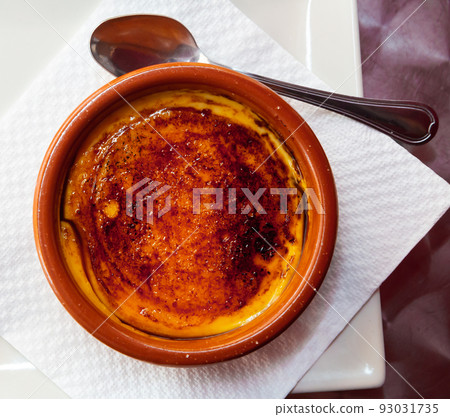 Catalan cream delicious dessert with sugar toast. Typical in Catalonia Spain Catalan cream delicious dessert with sugar toast. Typical in Catalonia Spain 93031735