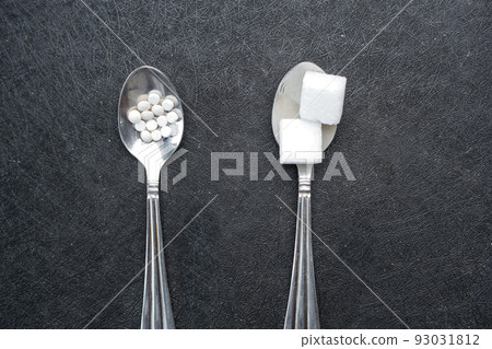 comparing artificial sweetener between raw sweet on a silver spoon comparing artificial sweetener between raw sweet on a silver spoon 93031812