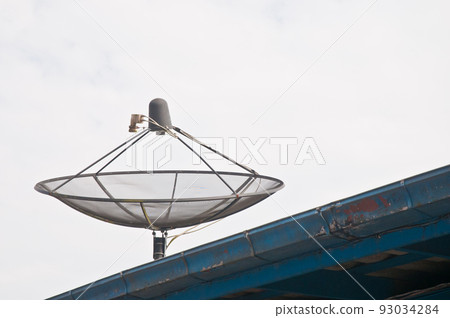 Modern satellite dishe on the roof top in cloudy day 93034284