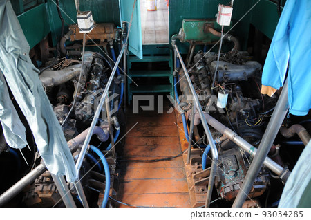 Dual old powerful engines of wooden ship sailing in the ocean. Dual old powerful engines of wooden ship sailing in the ocean. 93034285