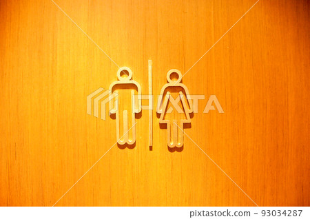 Man and woman sign symbols of toilet wooden doorin a pub 93034287