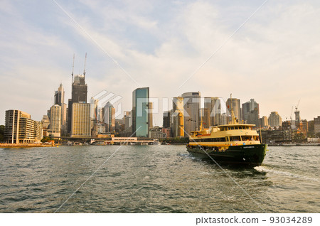 SYDNEY, AUSTRALIA - APRIL 13, 2019: Evening scene of Central Business District of Sydney Harbour and passengers ferry in Sydney  Australia 93034289