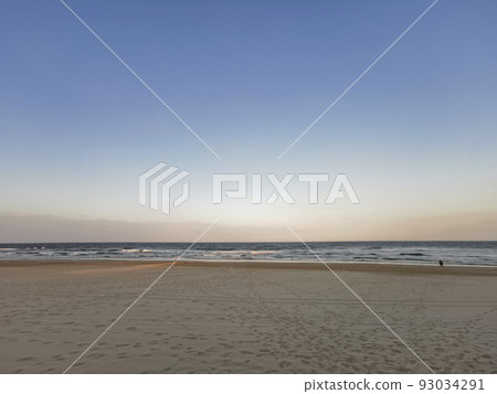 Evening Sunset scene of Surfer Paradise sandy calm quiet beach in Gold Coast Australia Evening Sunset scene of Surfer Paradise sandy calm quiet beach in Gold Coast Australia 93034291