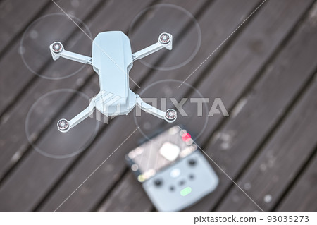 Preparing the drone for flight 93035273