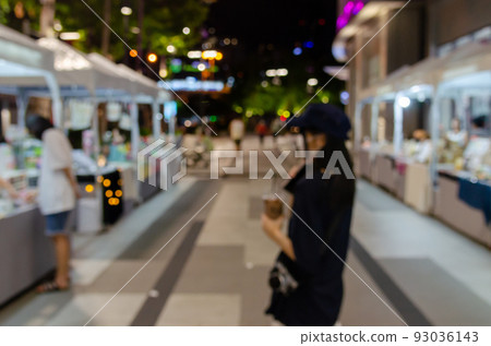 Blur background abstract people shopping night market street food festival defocused. Blur background abstract people shopping night market street food festival defocused. 93036143