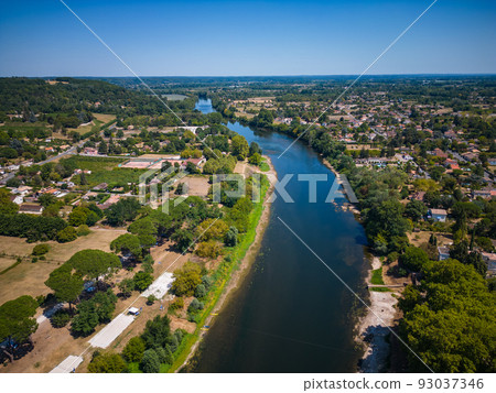 Aerial view of Sainte Foy la Grande and Dordogne river, Gironde, France 93037346
