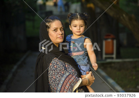 Young mother with her two years girl  in her hug 93037926