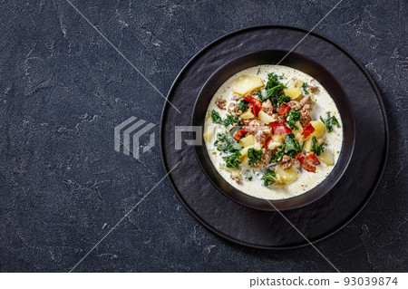 Zuppa Toscana,Tuscan Soup in black bowl, top view Zuppa Toscana,Tuscan Soup in black bowl, top view 93039874