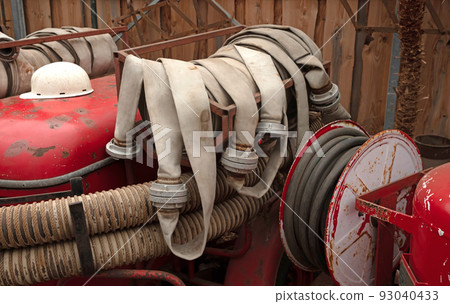 Fire hose of an old fire truck Fire hose of an old fire truck 93040433