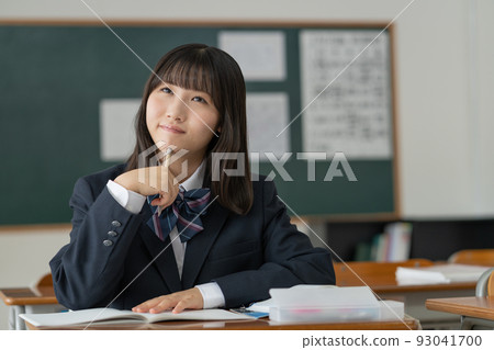 High school girl studying in a school classroom 93041700
