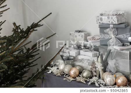 Gifts and Christmas toys on the table Gifts and Christmas toys on the table 93042865