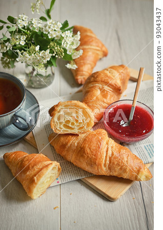 Closeup Table with baked croissant and tea 93043437