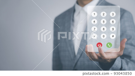 Dialing on virtual telephone keypad with transparent telephone buttons, businessman touch Emergency button of telephone number on screen, Finger touch number on smartphone to make a call, close up, 93043850