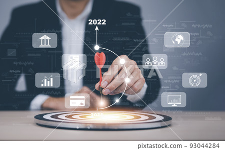 Targeting the business concept, Businessman touch red arrow dart to the virtual target dartboard, Executive marketing, investment goal and target for business investment concept, icon with cubes wood. 93044284
