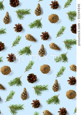 Pine cone Christmas background on blue. Pine branches and cones. minimal creative cone arrangement pattern. flat lay, Modern christmas Background. Pine cone Christmas background on blue. Pine branches and cones. minimal creative cone arrangement pattern. flat lay, Modern christmas Background. 93044846