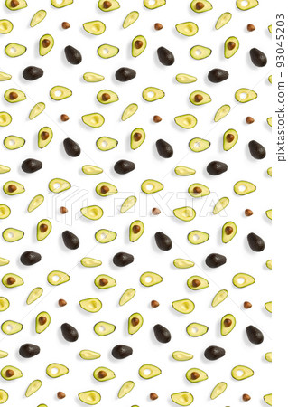 Avocado. Background made from isolated Avocado pieces on white background. Flat lay of fresh ripe avocados and avacado pieces. Avocado. Background made from isolated Avocado pieces on white background. Flat lay of fresh ripe avocados and avacado pieces. 93045203