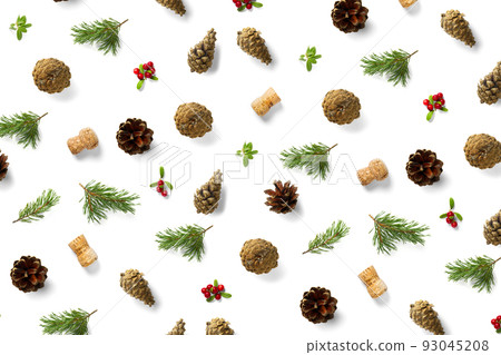 christmas background with pine cone, wine cork, pine twig and lingonberry. christmas background on white backdrop. christmas background with pine cone, wine cork, pine twig and lingonberry. christmas background on white backdrop. 93045208