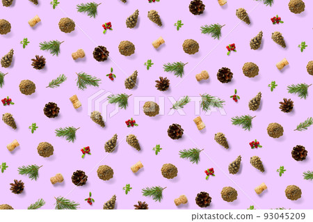 christmas background with pine cone, wine cork, pine twig and lingonberry. christmas background on pink backdrop. christmas background with pine cone, wine cork, pine twig and lingonberry. christmas background on pink backdrop. 93045209