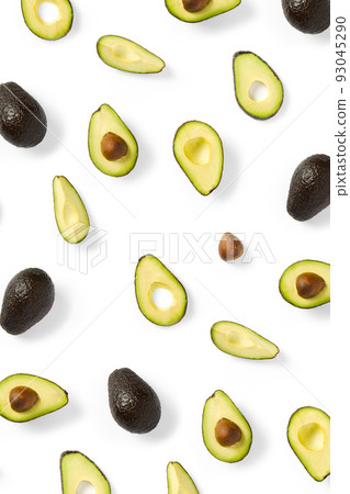 Avocado. Background made from isolated Avocado pieces on white background. Flat lay of fresh ripe avocados and avacado pieces. 93045290