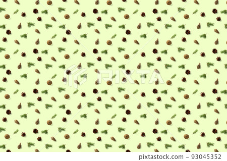 Pine cone Christmas background on green. Pine branches and cones. minimal creative cone arrangement pattern. flat lay, Modern christmas Background. 93045352