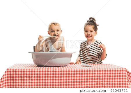 Morning procedures. Two happy little kids, boy and girl in retro style outfits wash face and brush teeth isolated on white background. Vintage style Morning procedures. Two happy little kids, boy and girl in retro style outfits wash face and brush teeth isolated on white background. Vintage style 93045721