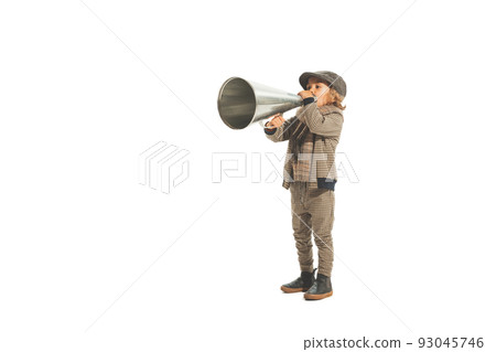 Charming little kid shouting through vintage megaphone. Communication concept. Retro style. Beauty, kids fashion, education, happy childhood Charming little kid shouting through vintage megaphone. Communication concept. Retro style. Beauty, kids fashion, education, happy childhood 93045746