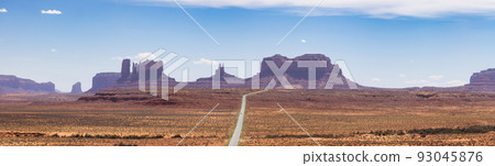 Scenic Road in the Dry Desert with Red Rocky Mountains in Background Scenic Road in the Dry Desert with Red Rocky Mountains in Background 93045876
