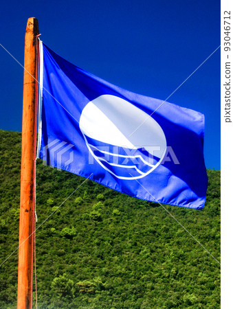 Blue flag is symbol of beautiful beach with crystal clear water 93046712