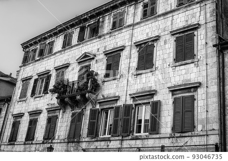 Closed green shutters on odl building in historic town Kotor in Montenegro Closed green shutters on odl building in historic town Kotor in Montenegro 93046735