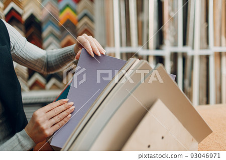 Framing Workshop. Choosing carton cardboard for baguette handmade picture frame at studio. Framing Workshop. Choosing carton cardboard for baguette handmade picture frame at studio. 93046971