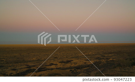 Panorama view to Aral sea from the rim of Plateau Ustyurt near Aktumsuk cape at sunset, Karakalpakstan, Uzbekistan 93047223