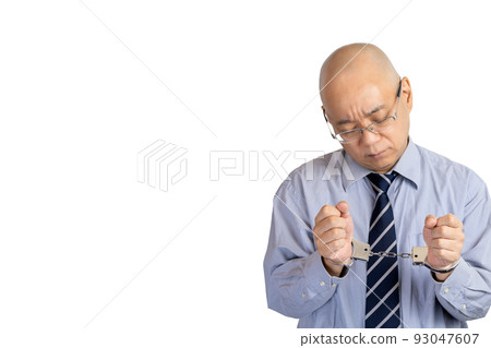 handcuffed businessman 93047607
