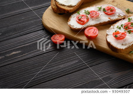 Toasts with microgreens on the table. Healthy food, vegan food and dieting concept. 93049307