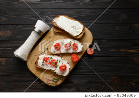 Toasts with microgreens on the table. Healthy food, vegan food and dieting concept. 93049309