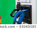 Electric Car Charging Gun at Charging Station 93049385