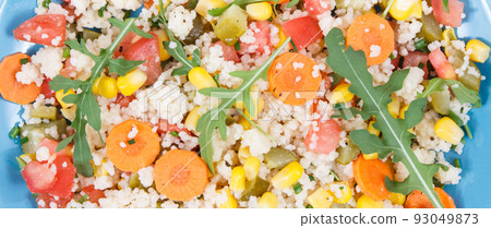 Fresh prepared salad with couscous and vegetables. Light dietary vegan meal 93049873