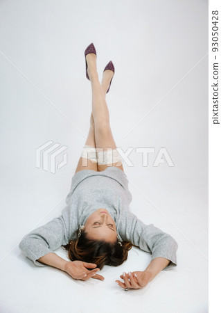 woman legs shoes stiletto heels white background 93050428
