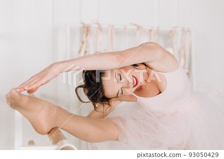beautiful girl ballerina doing leg warm up beautiful girl ballerina doing leg warm up 93050429