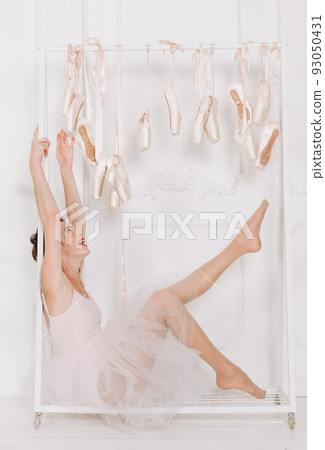 beautiful girl ballerina doing leg warm up beautiful girl ballerina doing leg warm up 93050431