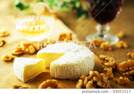 Camembert cheese cut and red wine Camembert cheese cut and red wine 93051517