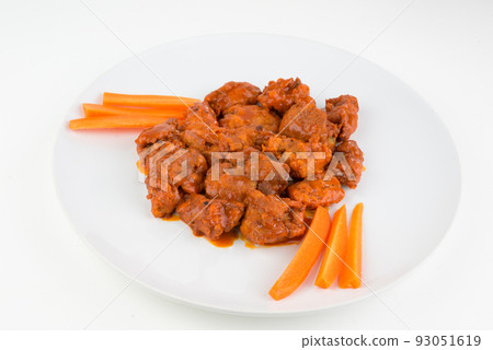 Boneless chicken wings with buffalo sauce and carrots Boneless chicken wings with buffalo sauce and carrots 93051619