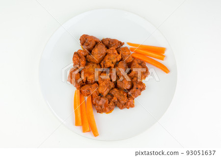 Boneless chicken wings with buffalo sauce and carrots 93051637