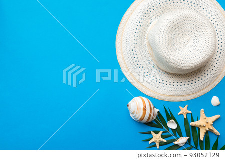 Summer holidays. Summer concept with straw hat and tropical leaf. Flat lay, top view, copy space Summer holidays. Summer concept with straw hat and tropical leaf. Flat lay, top view, copy space 93052129