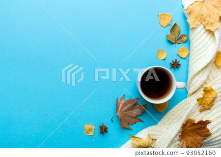 Flat lay composition with colorful Autumn cup of coffee and leaves on a color background. top view 93052160