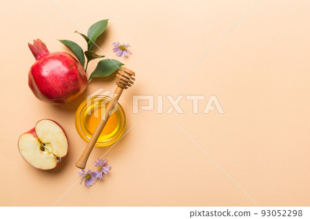 Flat lay composition with symbols jewish Rosh Hashanah holiday attributes on colored background, Rosh hashanah concept. New Year holiday Traditional. Top view with copy space Flat lay composition with symbols jewish Rosh Hashanah holiday attributes on colored background, Rosh hashanah concept. New Year holiday Traditional. Top view with copy space 93052298