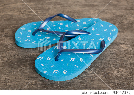 Beach accessories. Flip flops and starfish on colored background. Top view Mock up with copy space Beach accessories. Flip flops and starfish on colored background. Top view Mock up with copy space 93052322