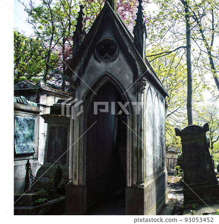 Tombstones in cemetery at dusk, gothic style crosses Paris close up Tombstones in cemetery at dusk, gothic style crosses Paris close up 93053452