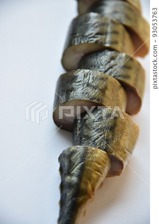 Cold smoked mackerel cut into slices on a white background. Cold smoked mackerel cut into slices on a white background. 93053763