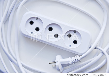 White electric extension cord, great design for any purposes. White background. White electric extension cord, great design for any purposes. White background. 93053826